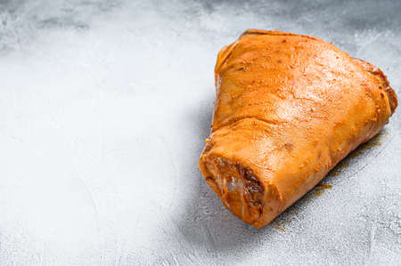 Raw marinated pork knuckle. Gray background. Top view. Copy space.の写真素材