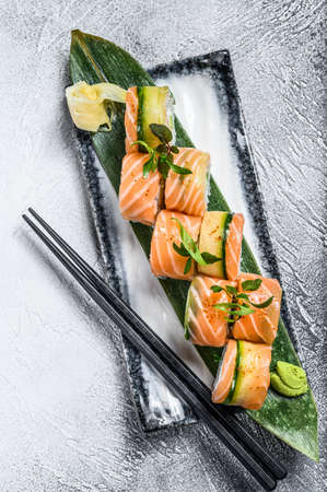 Sushi roll Philadelphia with salmon, avocado, cream cheese. Sushi menu. Japanese food. White background. Top view.の写真素材