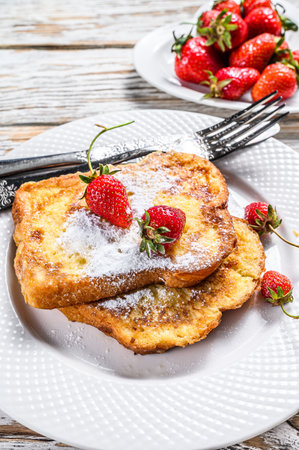 French Toasted with strawberry. Healthy Breakfast. White background. Top viewの写真素材