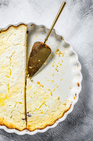 Curd casserole in a baking dish. Gray background. Top view.の写真素材