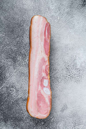 Fresh pork belly bacon block. White background. Top view.