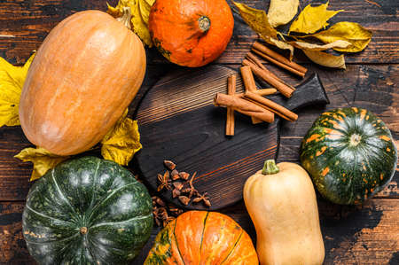 Thanksgiving day or autumn pumpkin holiday background. Dark Wooden background. Top view.の写真素材