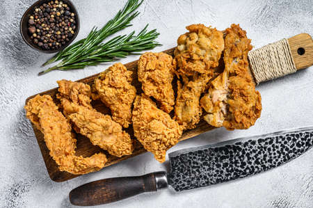 Delicious crispy fried breaded chicken parts. White background. Top view.の写真素材