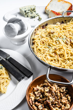 Spaghetti pasta with blue Gorgonzola cheese sauce. White background. Top view.の写真素材