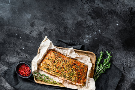A healthy diet high protein, smoked atlantic salmon fillet. trout. Black background, top view, space for text.の写真素材