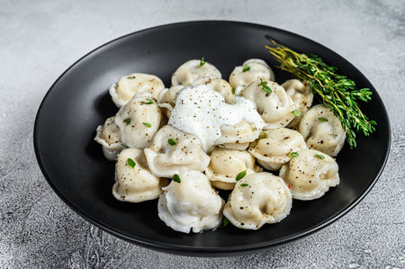 Italian ravioli dumplings with meat. White background. top view.の写真素材