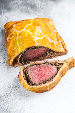 Beef Wellington puff pie classic steak dish with tenderloin meat. White background. Top view.の写真素材