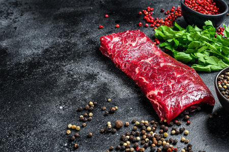 Raw marble beef meat steak. Black background. Top view. Copy space.の写真素材