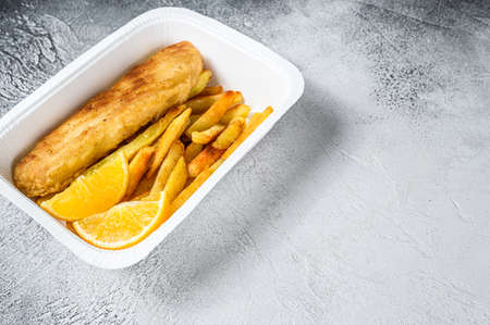 Takeaway box Fish and chips dish with french fries. White background. Top view. Copy spaceの写真素材