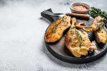 Butchered roast goose, breast fillet, wing, leg. White background. Top view. Copy spaceの写真素材