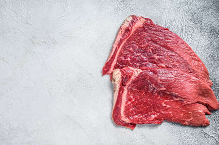 Raw fresh beef meat round steak. White background. Top view. Copy spaceの写真素材