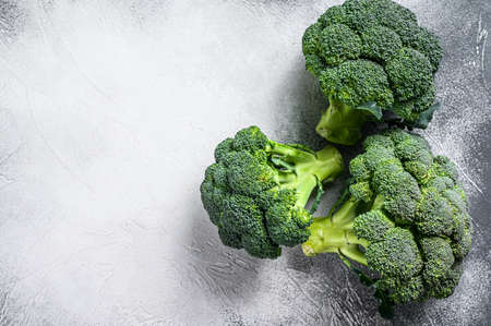 Green raw broccoli cabbage. White background. Top view. Copy spaceの写真素材