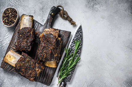 Barbecue short chuck beef ribs with herbs. White background. Top view. Copy spaceの写真素材