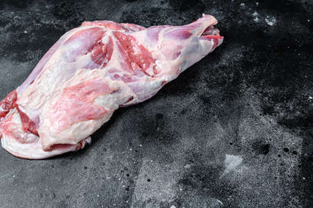 Raw lamb shoulder meat. Black background. Top view. Copy space