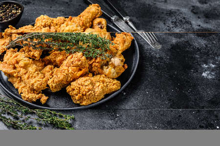 Breaded Fried Crispy Various Chicken. Black background. Top view. Copy spaceの写真素材
