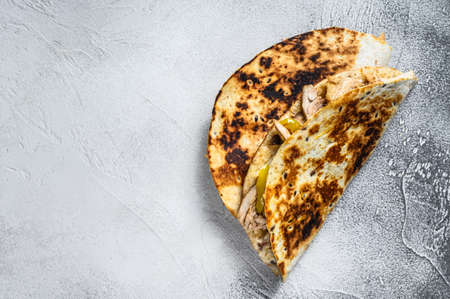 Cheesy Chicken roast Quesadilla. White background. Top view. Copy spaceの写真素材