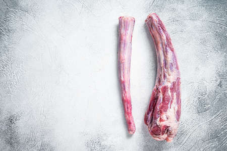 Raw whole Beef veal Oxtail Meat on butcher table. White background. Top view. Copy spaceの写真素材