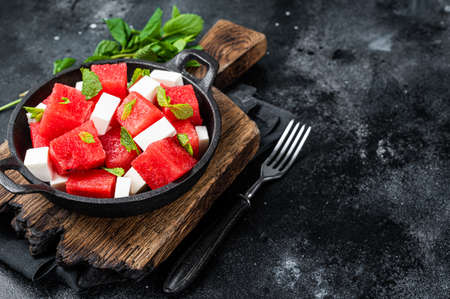 Healthy Organic Watermelon Salad with feta cheese. Black background. Top view. Copy spaceの写真素材