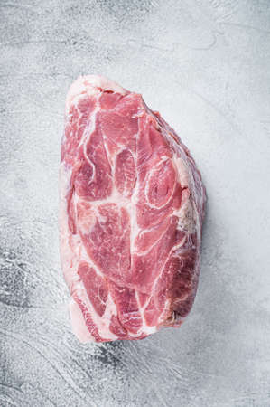 Raw pork neck meat for Chop steak on kichen table. White background. Top viewの写真素材