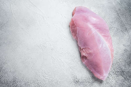 Raw whole big turkey breast fillet. White background. Top View. Copy spaceの写真素材