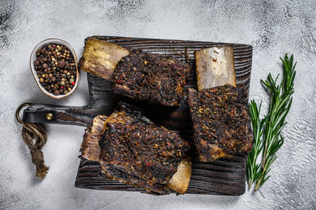 Barbecue short chuck beef ribs with herbs. White background. Top view