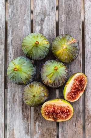 Healthy Organic Green Figs. Top view. Wooden backgroundの写真素材