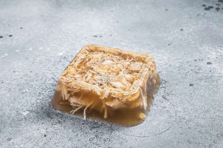 Aspic chicken meat jelly on kitchen table. Gray background. Top viewの写真素材