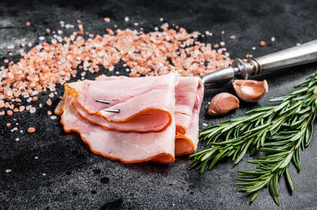 Sliced Ham from pork meat, Prosciutto cotto. Black background. Top viewの写真素材