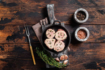 Fresh Raw beef Marrow bones in pan for cooking broth. Wooden background. Top viewの写真素材