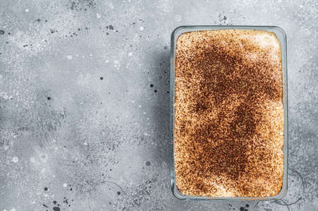 Tiramisu Italian dessert topped with cocoa. Gray background. Top view. Copy spaceの写真素材