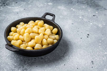 Cooked Gnocchi with Butter and Pepper. Gray background. Top view. Copy spaceの写真素材