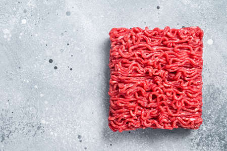 Raw Mince Ground meat on a butcher table. Gray background. Top view. Copy spaceの写真素材