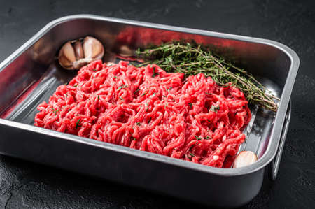 Raw beef Force meat, ground meat. Black background. Top viewの写真素材