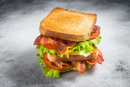 BLT toasted sandwich with bacon, tomato and lettuce. Gray background. Top viewの写真素材