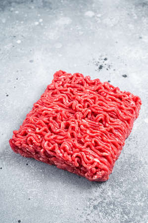 Raw Mince Ground meat on a butcher table. Gray background. Top viewの写真素材