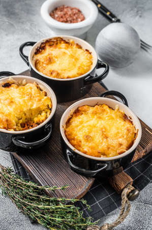British dish Shepherds pie with ground meat, mashed potato and cheddar cheese crust. White background. Top viewの写真素材