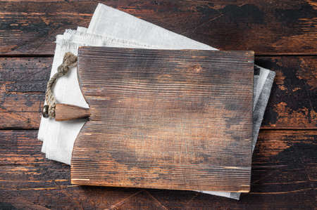 Directly Above view Of Cutting Board On dark Wooden Table. Wooden background. Top view. Copy spaceの写真素材