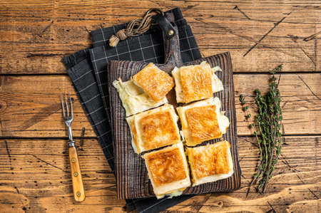 Delicious Turkish Tray pastry, Su boregi with cheese. wooden background. top view.の写真素材