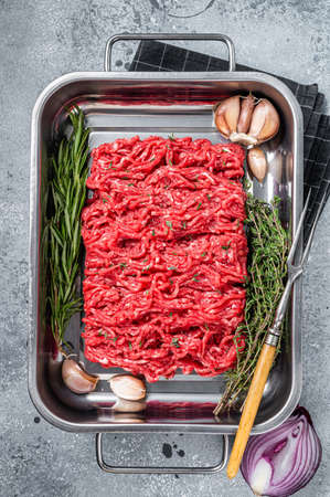 Fresh Raw Ground, Mince, minced beef and lamb meat. gray background. top view.の写真素材