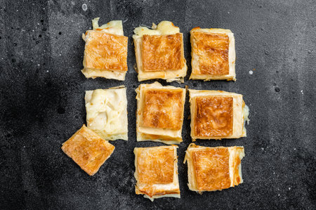Turkish Su Boregi, Tabla borek or burek with cheese. Black background. top view.の写真素材