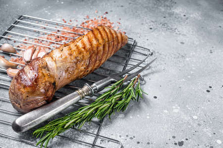 Grilled pork tenderloin fillet meat on grill. gray background. top view. copyspace.の写真素材