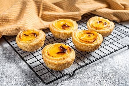 Traditional Portuguese pastry - pastel de nata fresh baked. white background. top view.