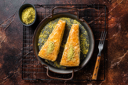 Turkish Havuc Dilim Baklava with pistachio. dark background. top view.の写真素材