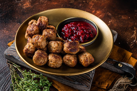 Beef meatballs with lingonberries jam, swedish meatballs. dark background. top view.の写真素材