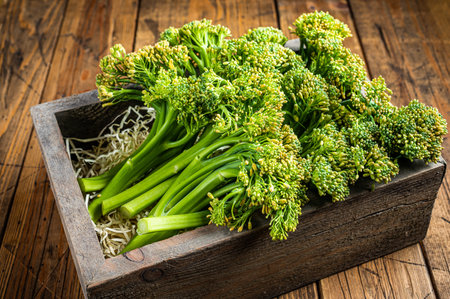 Raw Organic Fresh Broccolini Vegetable in a wooden box. wooden background. top view.の写真素材