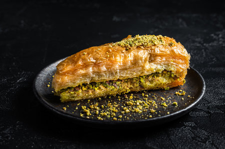 Turkish Havuc Dilim Baklava with pistachio, Carrot Slice Baklava. Black background. top view.の写真素材