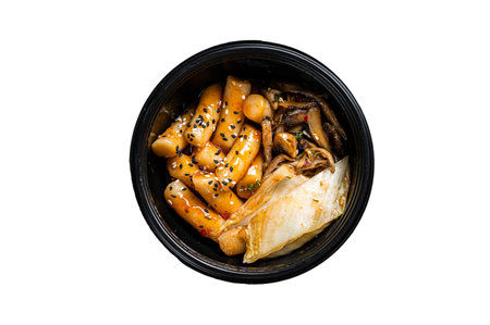 Korean street food Tteokbokki, Topokki fried rice cake stick in spicy sauce. isolated on white...
