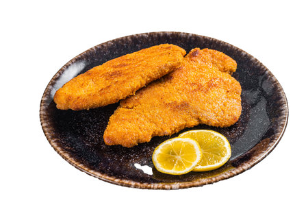 Roasted breaded german weiner schnitzel on a plate. isolated on white background.の写真素材