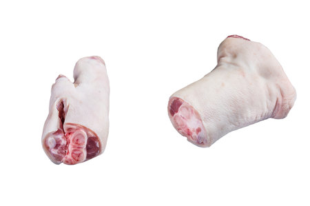 Raw pork hoof, feet, trotters on a butcher board. isolated on white backgroundの写真素材