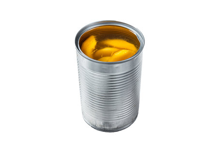 Canned mango slices in syrup in a metal can. isolated on white backgroundの写真素材
